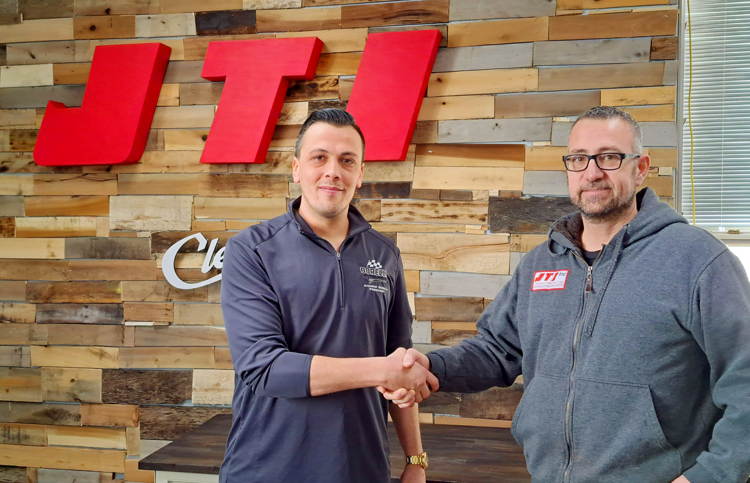 Andrew Borelli and Andrew Startzenbach shake hands forming sponsorship between Borelli Motorsports a…