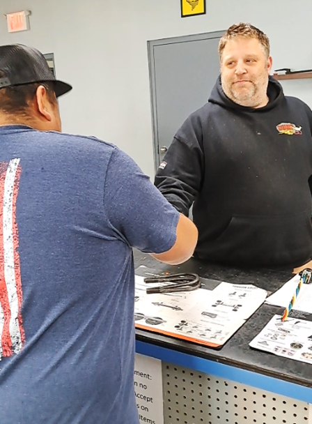 Matt shakes the hand of a satisfied customer